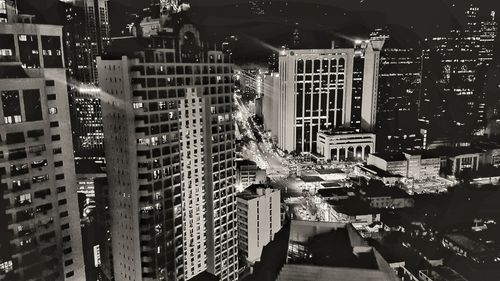 Aerial view of illuminated city at night