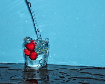 Close-up of red berries in water