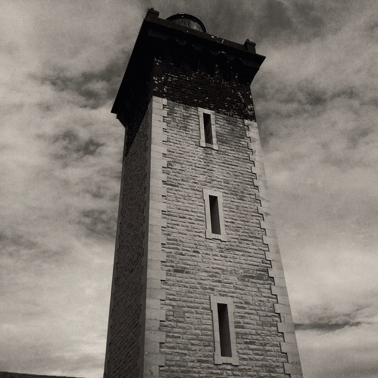 architecture, building exterior, built structure, low angle view, sky, cloud - sky, tower, window, old, building, outdoors, exterior, cloud, day, no people, cloudy, history, tall - high, house, wall - building feature