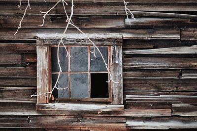 Broken window of abandoned house