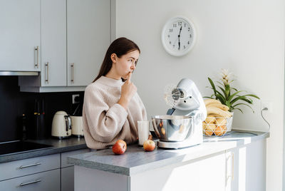 Cute girl preparing food at home