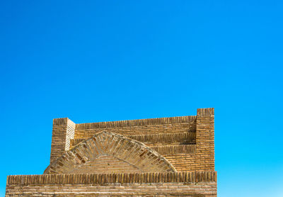 Low angle view of building against blue sky