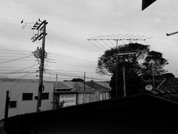 Low angle view of electricity pylon against sky