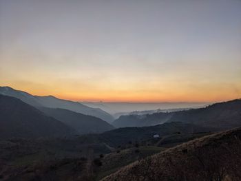 Scenic view of mountains against sky during sunset