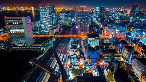 Tokyo, japan modern urban skyline at night overlooking the tower.