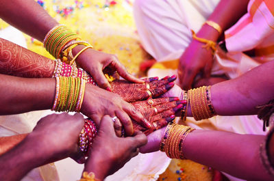 Close-up of female hands performing indian wedding traditions