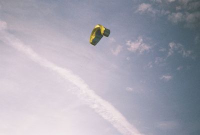 Low angle view of airplane flying in sky