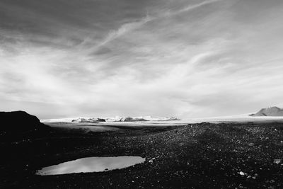 Scenic view of land against sky during winter