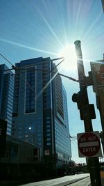 Low angle view of road signs against sky