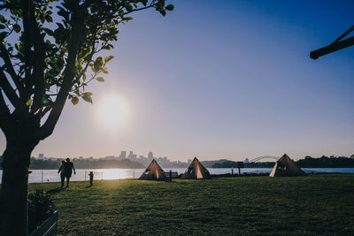 Scenic view of park against clear sky during sunset