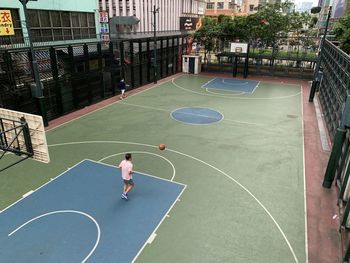 High angle view of basketball playing with ball in background