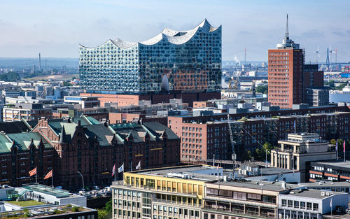 High angle view of buildings in city against sky