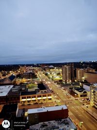 High angle view of illuminated buildings in city against sky