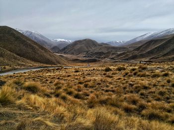 Scenic view of landscape and mountains against sky