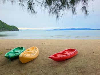 High angle view of shoes on beach against sea