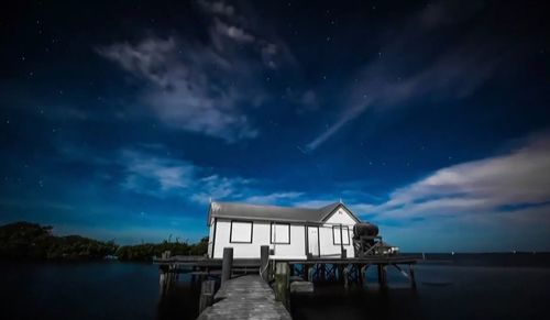 Scenic view of sea against sky at night