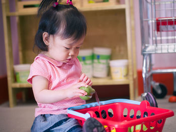 Cute girl playing with toys