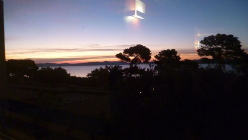 Scenic view of sea against sky at sunset