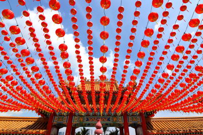 Low angle view of lanterns hanging on roof