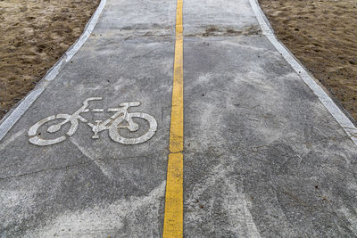 High angle view of bicycle lane sign on road