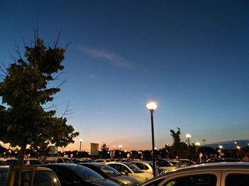 Cars on street in city at dusk