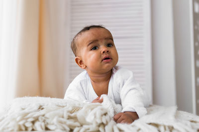 Portrait of cute baby boy at home