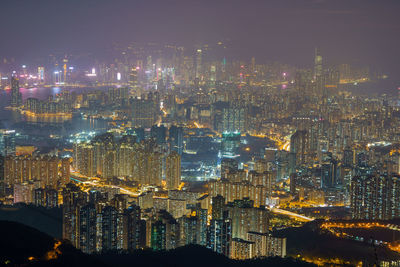 High angle view of illuminated buildings in city at night