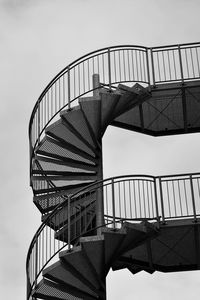 Low angle view of spiral staircase against sky