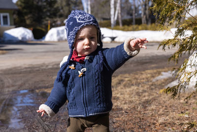 Full length of cute girl standing in snow