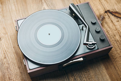 Listening to music from vinyl record. playing music from analog disk on turntable player. vintage