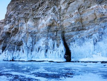 Scenic view of sea by snow