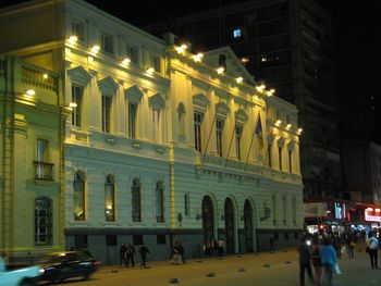 Buildings in city at night