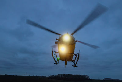 Helicopter of emergency medical service during take off at night. themes rescue, help and hope.