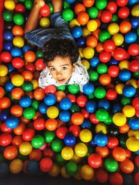 Portrait boy playing at ball pool