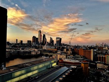 High angle view of buildings against sky during sunset