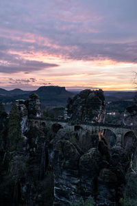 Scenic view of rock formation against sky during sunset