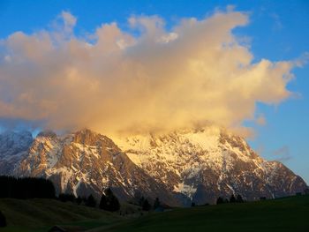 Scenic view of snow covered mountains against sky