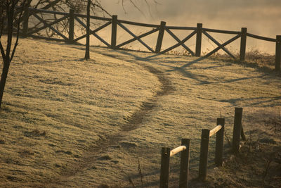 Wooden fence on field