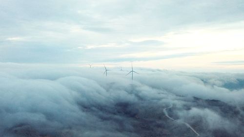 Scenic view of clouds over landscape against sky