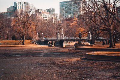 Empty pond and buildings in city