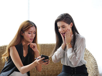 Young woman using mobile phone