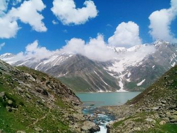 Scenic view of lake and mountains against sky