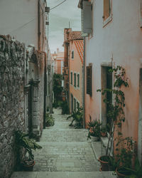Narrow alley amidst buildings in town