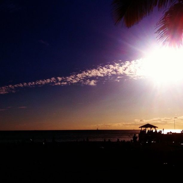 sun, sunset, sea, silhouette, sunbeam, scenics, water, tranquil scene, beauty in nature, sunlight, sky, tranquility, horizon over water, beach, lens flare, nature, idyllic, bright, shore, outdoors