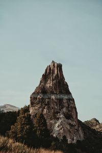 Low angle view of rock formation against sky