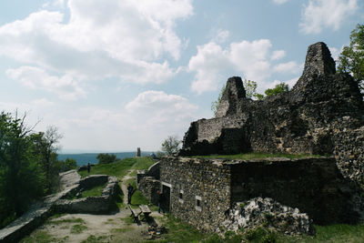 Old ruins on mountain against sky