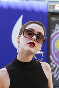 Portrait of young woman with short hair wearing eyeglasses