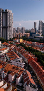 High angle view of buildings in city against sky