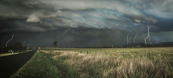 Field against cloudy sky