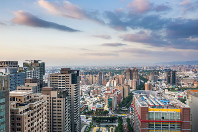 High angle view of buildings in city against sky